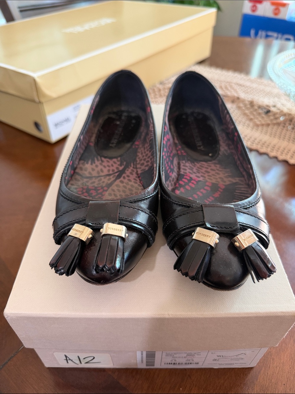 Burberry Black Leather Tassel Ballet Flats with Gold Accents